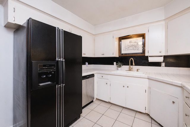 4500 Glenmere Rd, North Little Rock, AR 72116 - kitchen with black refrigerator with ice dispenser, dishwasher, a sink, light tile patterned flooring, and white cabinets