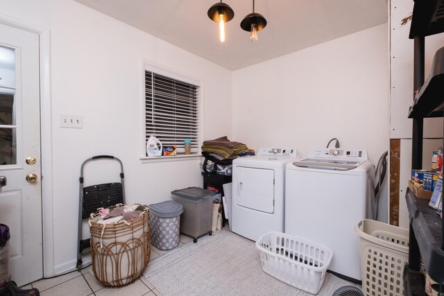 4500 Glenmere Rd, North Little Rock, AR 72116 - laundry area featuring washer and dryer and light tile patterned floors