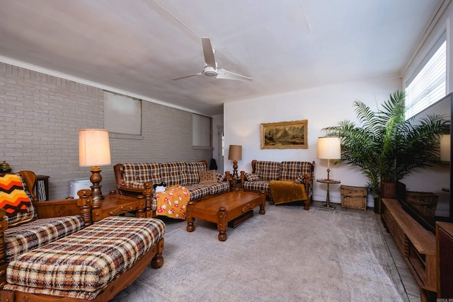 4500 Glenmere Rd, North Little Rock, AR 72116 - carpeted living area with a ceiling fan, brick wall, and crown molding