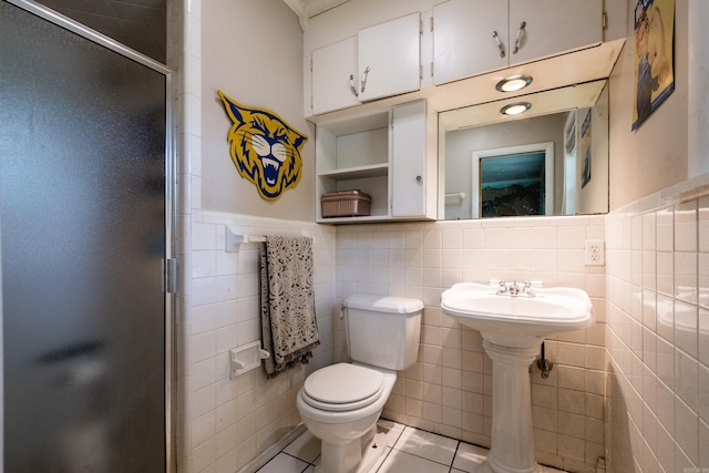 4500 Glenmere Rd, North Little Rock, AR 72116 - full bath with toilet, a shower stall, tile walls, tile patterned floors, and wainscoting