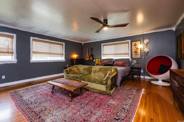 4500 Glenmere Rd, North Little Rock, AR 72116 - living room with crown molding, ceiling fan, wood finished floors, and baseboards