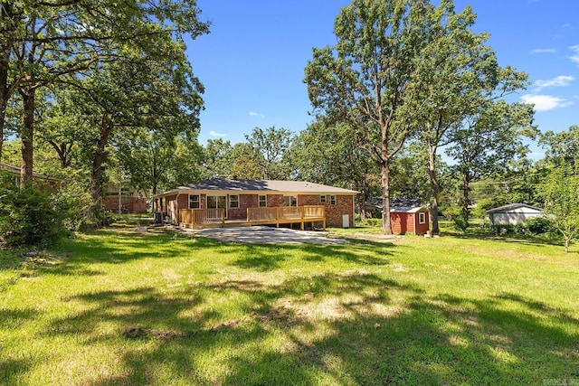 6513 Corsica Dr, North Little Rock, AR 72116 - view of green lawn featuring a wooden deck