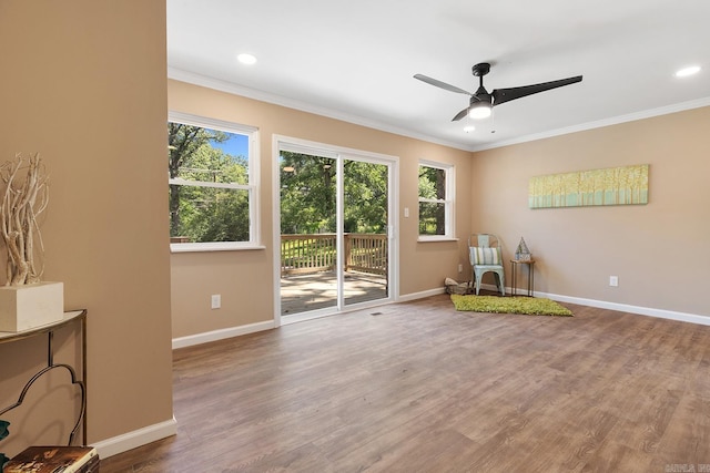 6513 Corsica Dr, North Little Rock, AR 72116 - sitting room with a ceiling fan, crown molding, wood finished floors, baseboards, and recessed lighting