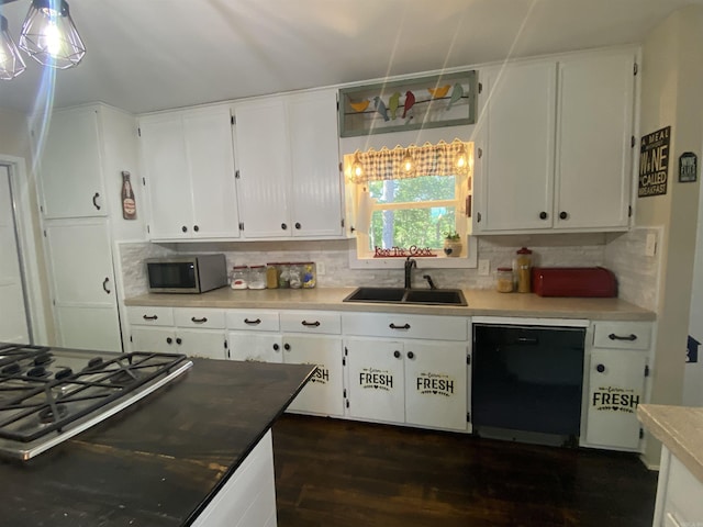 16 Mockingbird Ln, Story, AR 71970 - kitchen featuring dishwasher, stainless steel microwave, a sink, cooktop, and dark wood-style flooring