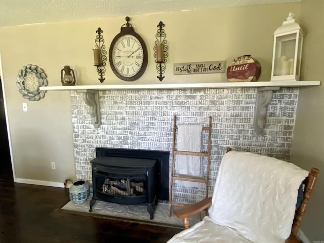 16 Mockingbird Ln, Story, AR 71970 - detailed view of wood finished floors, baseboards, and a textured ceiling