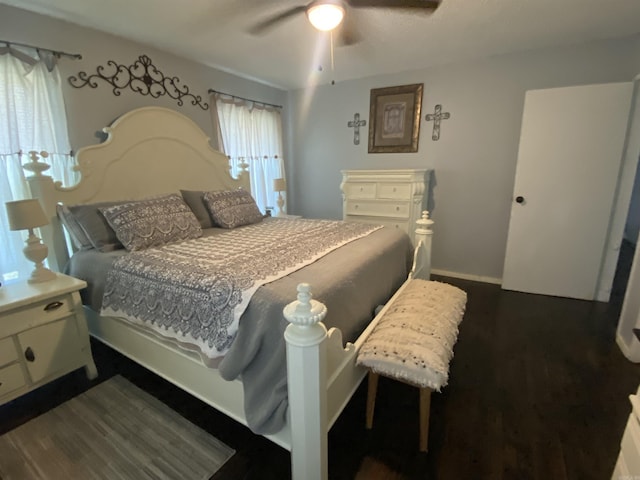 16 Mockingbird Ln, Story, AR 71970 - bedroom with baseboards, dark wood-style floors, and ceiling fan