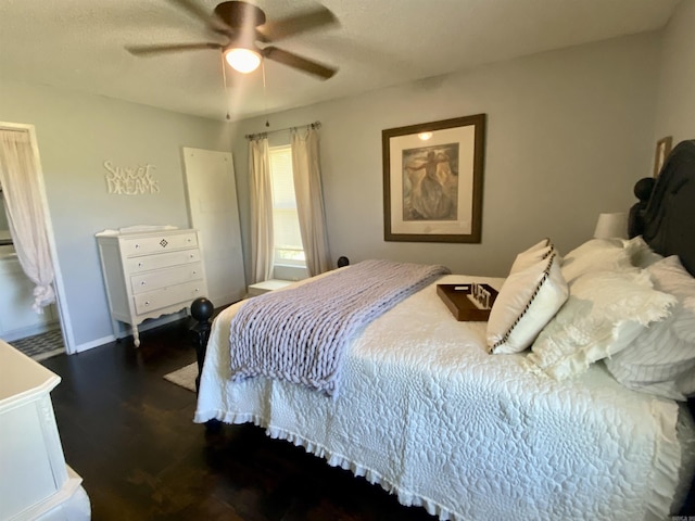 16 Mockingbird Ln, Story, AR 71970 - bedroom with wood finished floors, ceiling fan, and baseboards