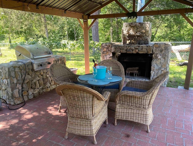 16 Mockingbird Ln, Story, AR 71970 - view of patio / terrace featuring an outdoor stone fireplace, grilling area, and a gazebo