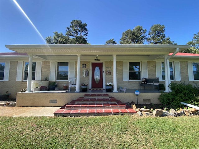 16 Mockingbird Ln, Story, AR 71970 - view of front of home featuring a porch and brick siding