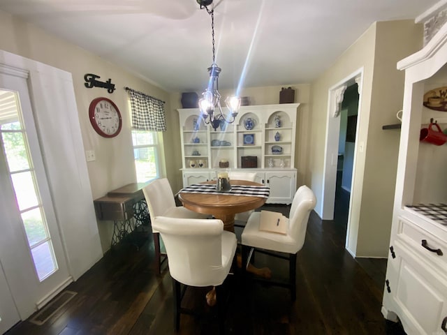 16 Mockingbird Ln, Story, AR 71970 - dining area with a chandelier and dark wood-style floors