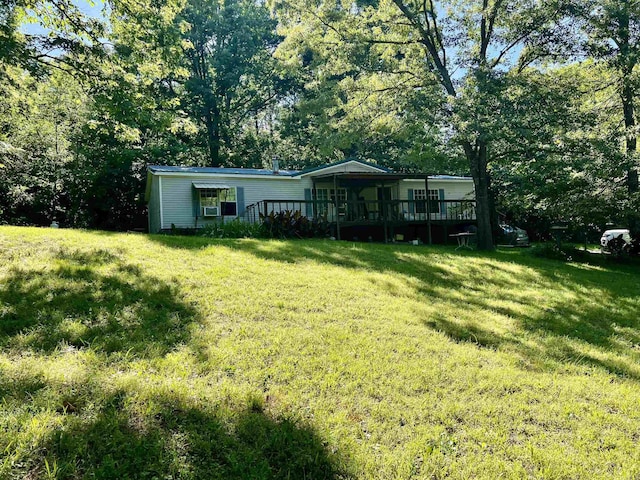 1263 Lost Creek Rd, Pearcy, AR 71964 - view of green lawn with a deck