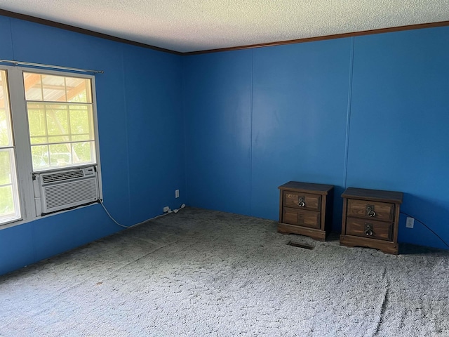 1263 Lost Creek Rd, Pearcy, AR 71964 - carpeted spare room with a textured ceiling, ornamental molding, cooling unit, and a decorative wall