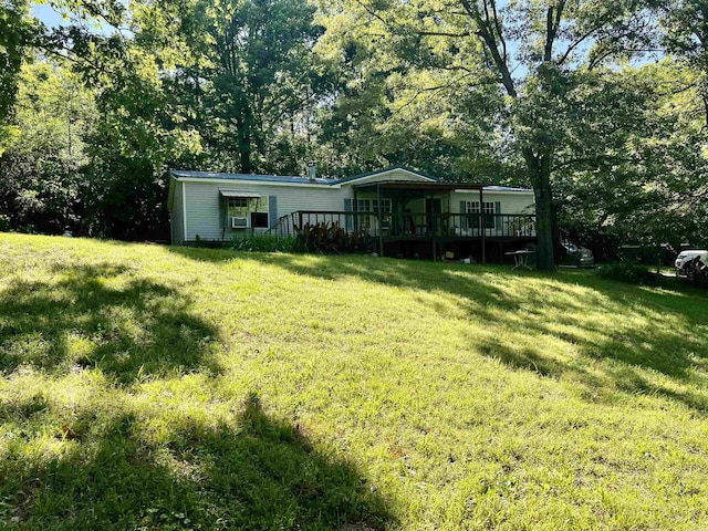 1263 Lost Creek Rd, Pearcy, AR 71964 - view of green lawn with a deck