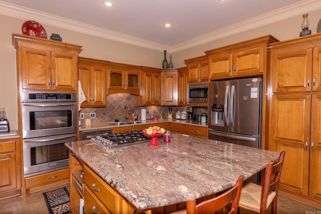 133 Scenic Valley Loop, Maumelle, AR 72113 - kitchen featuring stainless steel appliances, a sink, brown cabinetry, a kitchen breakfast bar, and tasteful backsplash