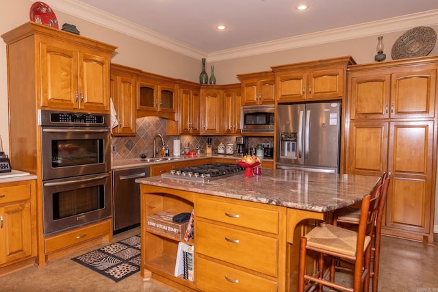 133 Scenic Valley Loop, Maumelle, AR 72113 - kitchen with stainless steel appliances, a sink, a breakfast bar area, decorative backsplash, and brown cabinets