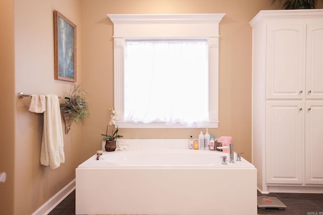 133 Scenic Valley Loop, Maumelle, AR 72113 - bathroom featuring a garden tub and baseboards