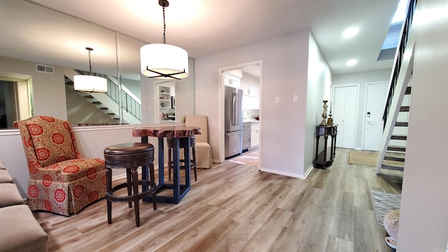 24 Fairway Woods Cir, Maumelle, AR 72113 - dining room with stairway, light wood-style floors, and recessed lighting