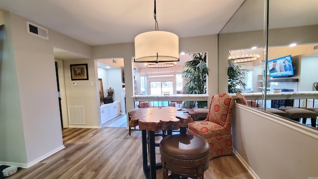 24 Fairway Woods Cir, Maumelle, AR 72113 - dining room featuring wood finished floors and baseboards