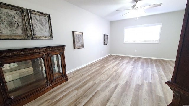 24 Fairway Woods Cir, Maumelle, AR 72113 - unfurnished living room featuring wood finished floors, ceiling fan, and baseboards