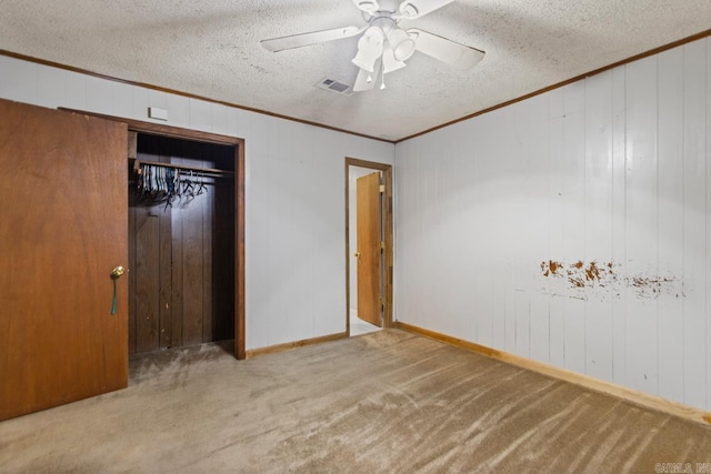 766 Grant 735 Rd, Sheridan, AR 72150 - unfurnished bedroom featuring crown molding, carpet, a textured ceiling, a ceiling fan, and a closet