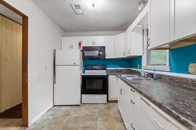 766 Grant 735 Rd, Sheridan, AR 72150 - kitchen with range with electric cooktop, freestanding refrigerator, black microwave, a sink, and a textured ceiling