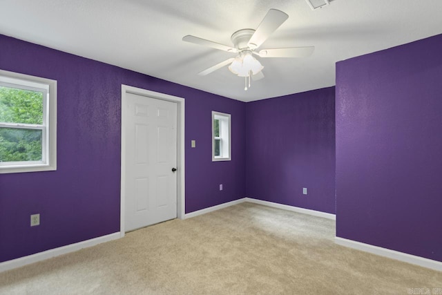 766 Grant 735 Rd, Sheridan, AR 72150 - unfurnished bedroom with carpet floors, baseboards, and a ceiling fan