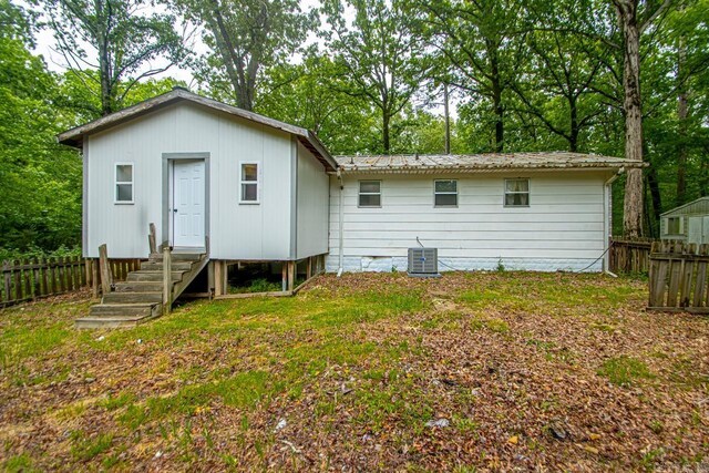 766 Grant 735 Rd, Sheridan, AR 72150 - back of house featuring central AC unit, entry steps, and metal roof