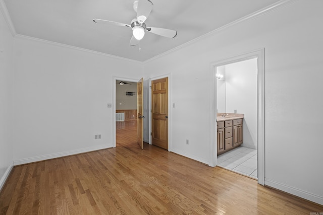 645 Drye Rd, Biscoe, AR 72017 - unfurnished bedroom with light wood-style floors, a sink, ornamental molding, baseboards, and ensuite bath