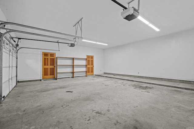 645 Drye Rd, Biscoe, AR 72017 - garage featuring a garage door opener