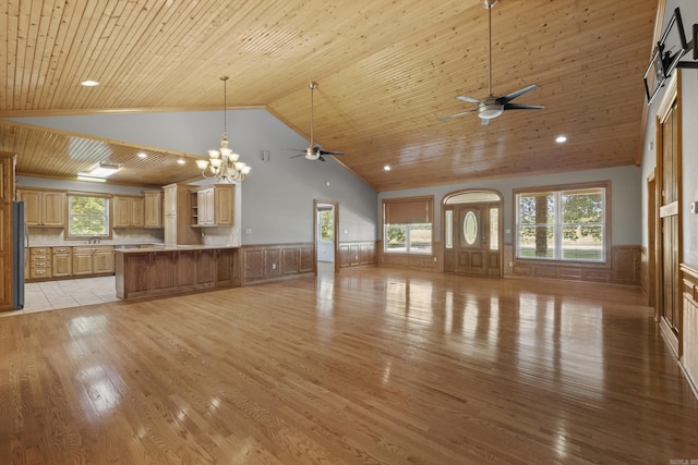 645 Drye Rd, Biscoe, AR 72017 - unfurnished living room with wainscoting, a ceiling fan, wooden ceiling, light wood-style floors, and high vaulted ceiling