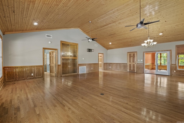 645 Drye Rd, Biscoe, AR 72017 - unfurnished living room featuring a wainscoted wall, ceiling fan, a chandelier, wood finished floors, and high vaulted ceiling