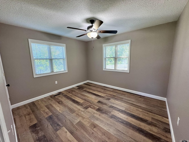 2174 N Main St, Melbourne, AR 72556 - unfurnished room featuring wood finished floors, a ceiling fan, baseboards, and a textured ceiling