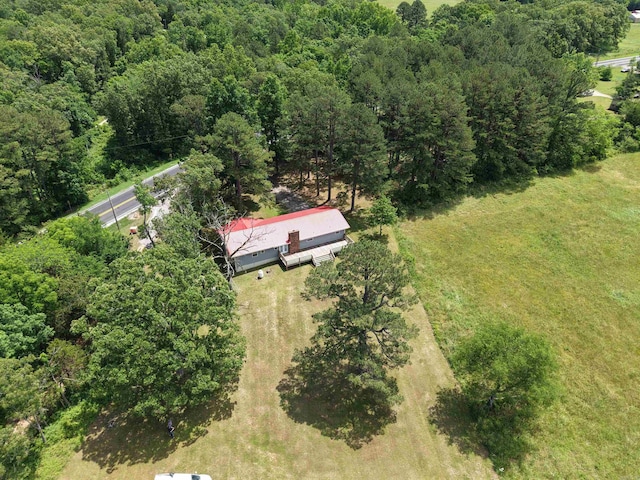 2174 N Main St, Melbourne, AR 72556 - aerial view of property and surrounding area with a heavily wooded area