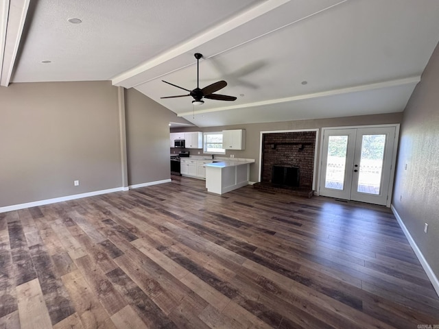 2174 N Main St, Melbourne, AR 72556 - unfurnished living room with a ceiling fan, dark wood finished floors, plenty of natural light, and baseboards