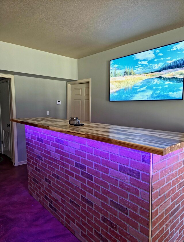 2000 Boundary Oaks Dr, Jonesboro, AR 72404 - indoor dry bar with a textured ceiling and concrete floors