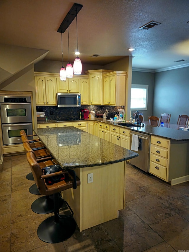 2000 Boundary Oaks Dr, Jonesboro, AR 72404 - kitchen featuring stainless steel appliances, crown molding, decorative backsplash, a peninsula, and dark stone counters