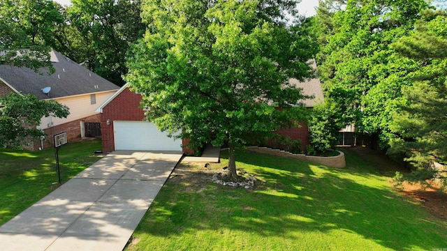 2000 Boundary Oaks Dr, Jonesboro, AR 72404 - view of front of property featuring brick siding, a garage, a front yard, and concrete driveway