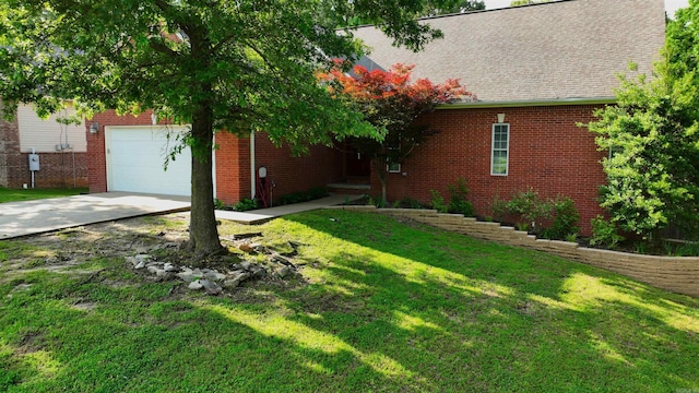 2000 Boundary Oaks Dr, Jonesboro, AR 72404 - view of front of house with a front yard, concrete driveway, and brick siding