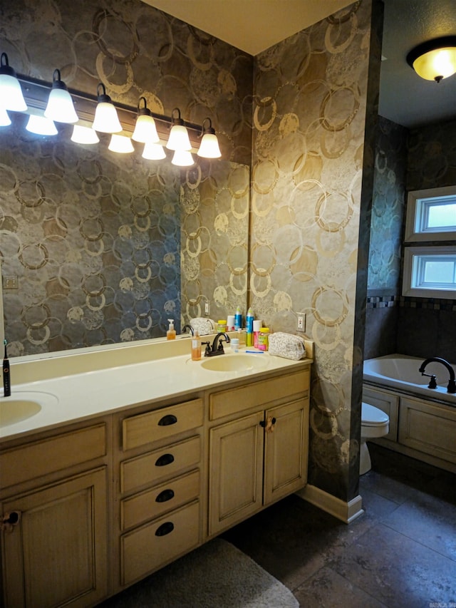 2000 Boundary Oaks Dr, Jonesboro, AR 72404 - full bathroom featuring a garden tub, double vanity, and toilet