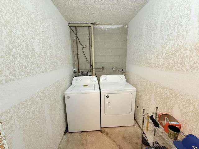 147 Winfree Ln, Melbourne, AR 72556 - washroom with separate washer and dryer, concrete block wall, and a textured ceiling