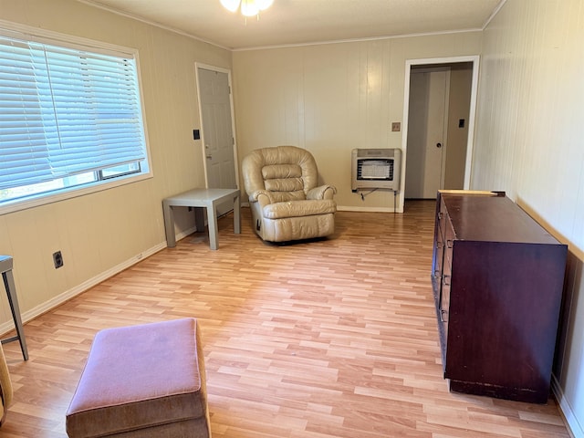 147 Winfree Ln, Melbourne, AR 72556 - sitting room with heating unit, ornamental molding, light wood-style flooring, and baseboards