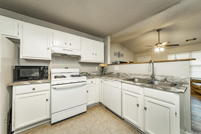 13 Fieldcrest Ln, Cabot, AR 72023 - kitchen featuring white appliances, under cabinet range hood, a sink, a peninsula, and vaulted ceiling