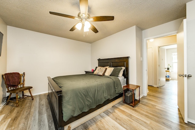 13 Fieldcrest Ln, Cabot, AR 72023 - bedroom with light wood-type flooring, a textured ceiling, baseboards, and a ceiling fan