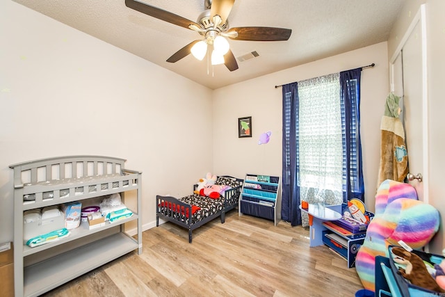 13 Fieldcrest Ln, Cabot, AR 72023 - bedroom featuring wood finished floors and ceiling fan
