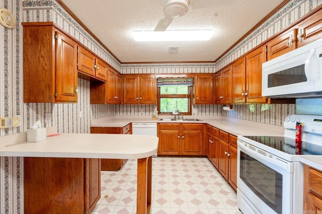 265 Zebulin Dr, Heber Springs, AR 72543 - kitchen with white appliances, wallpapered walls, a sink, a textured ceiling, and light countertops