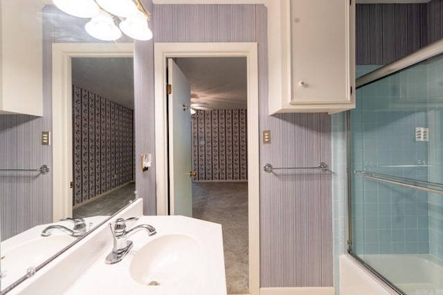 265 Zebulin Dr, Heber Springs, AR 72543 - bathroom with wallpapered walls, shower / bath combination with glass door, and vanity