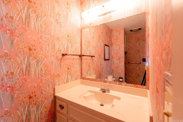 265 Zebulin Dr, Heber Springs, AR 72543 - half bathroom featuring vanity and wallpapered walls