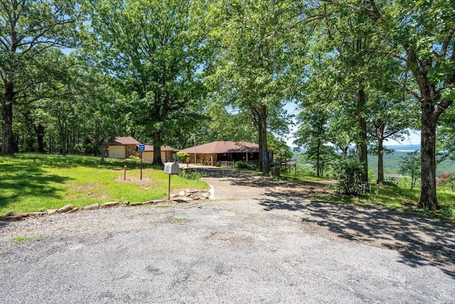 265 Zebulin Dr, Heber Springs, AR 72543 - view of green lawn with asphalt driveway