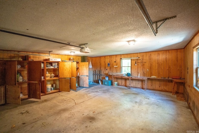265 Zebulin Dr, Heber Springs, AR 72543 - garage featuring wood walls and a garage door opener