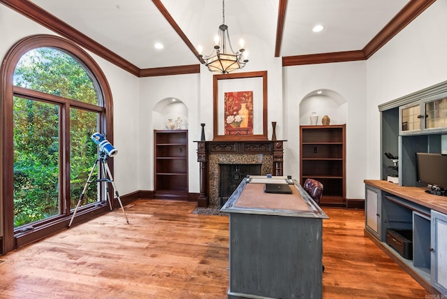 31 Cravache Ct, Little Rock, AR 72223 - office area with a chandelier, crown molding, a premium fireplace, wood finished floors, and baseboards